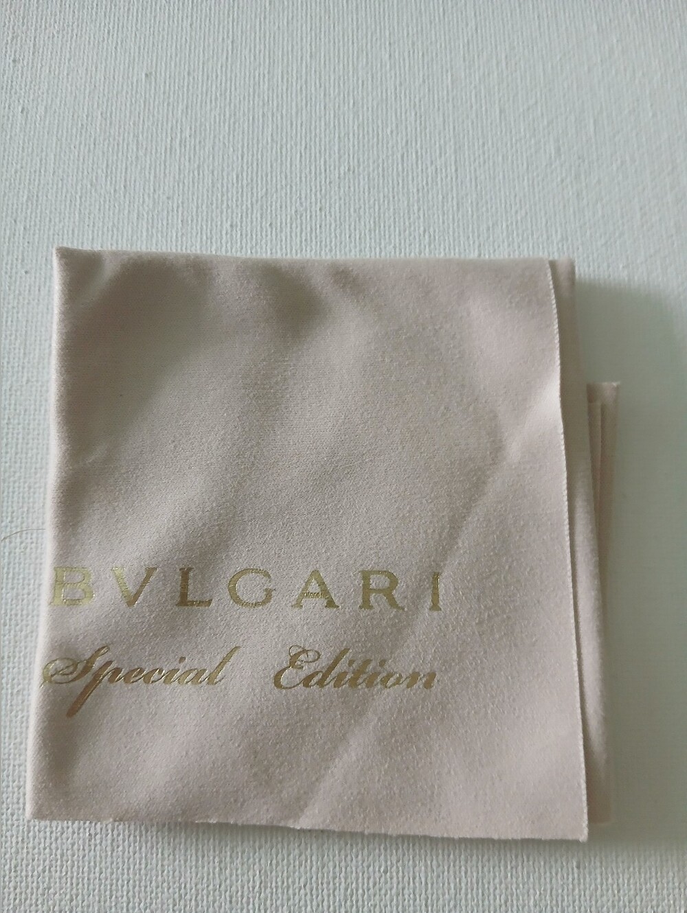 Bvlgari beige and gold microfiber pouch